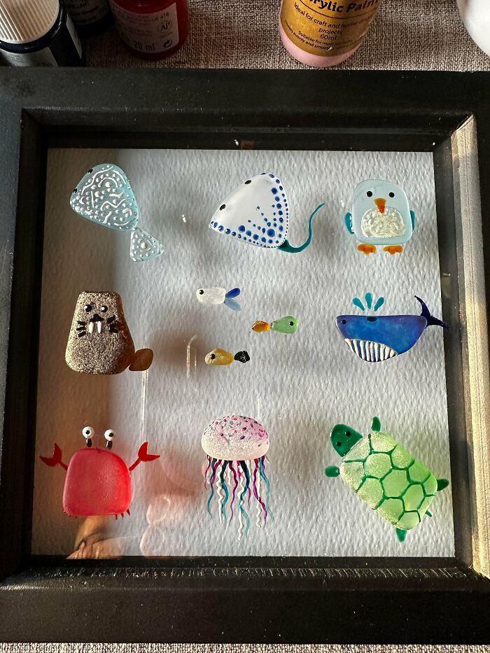 Colorful creative glass sea animal art pieces framed in black, showcasing cool glass items perfect for home decoration.