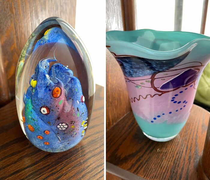 Two creative glass items with colorful abstract designs displayed on a wooden surface for home decor.