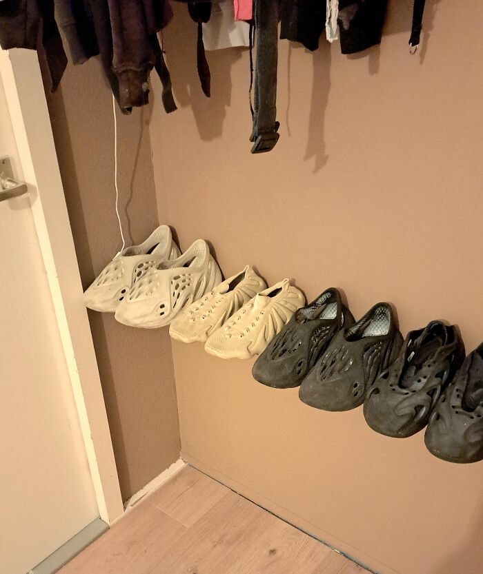 Shoes seemingly floating on the wall in a hallway, an unedited photo that might mess with your tired brain.