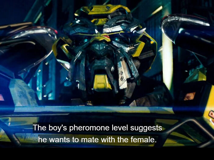 Robotic figure with a caption about toxic men and pheromone levels suggesting mating intent toward a female.