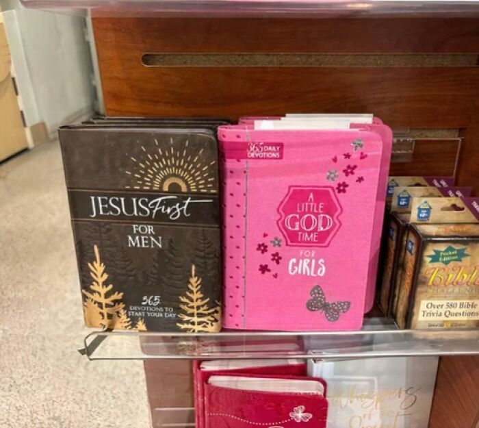 Religious devotion books for men and girls displayed on a shelf, highlighting daily spiritual reading materials.