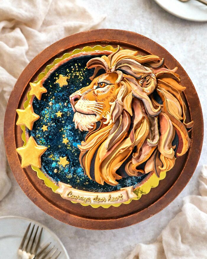 Lion design cake with gold stars and artistic dessert decoration
