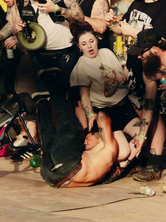 Chaos and drama of people falling at a party resembling an Accidental Renaissance painting