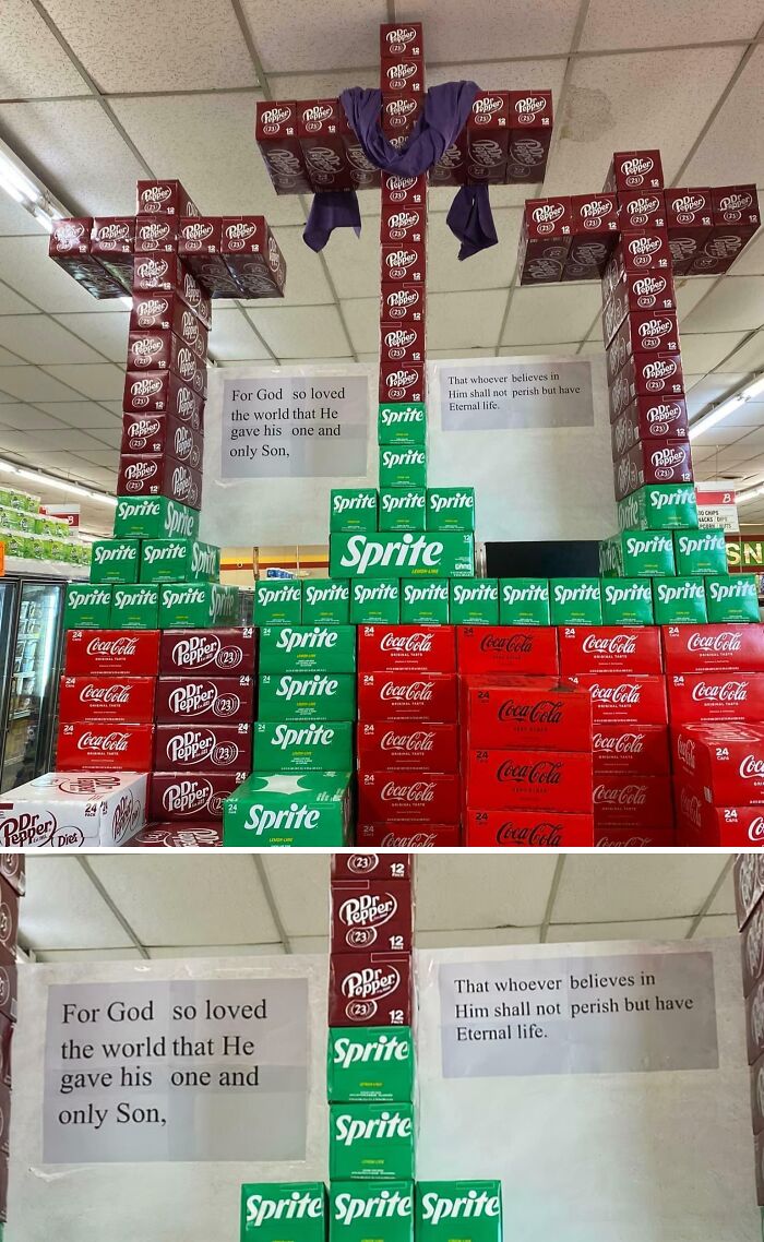 Stacked soda boxes shaped as three crosses with Bible verse, capturing the essence of faith in US states.