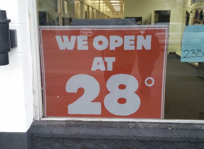 Sign in a storefront window stating we open at 28 degrees, capturing a unique aspect of the essence of each state in the US.