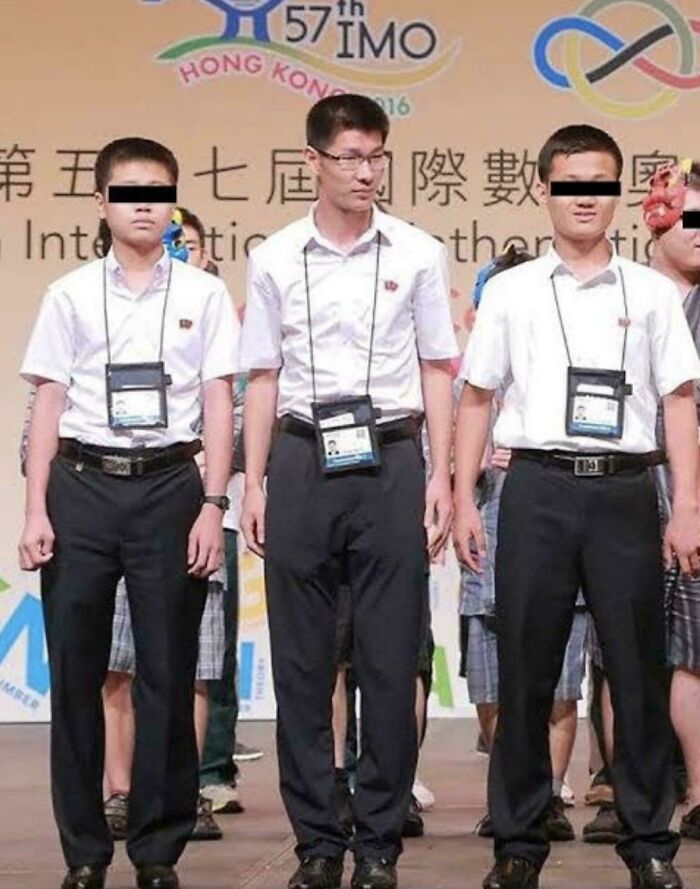 Three young men with black bars over their eyes wearing white shirts and black pants at a math event, highlighting interesting vault stories.