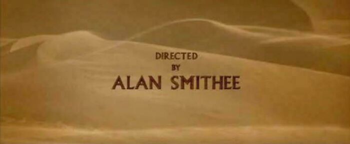 Directed by Alan Smithee text over desert dunes, illustrating an interesting vault of bizarre and cool stories.