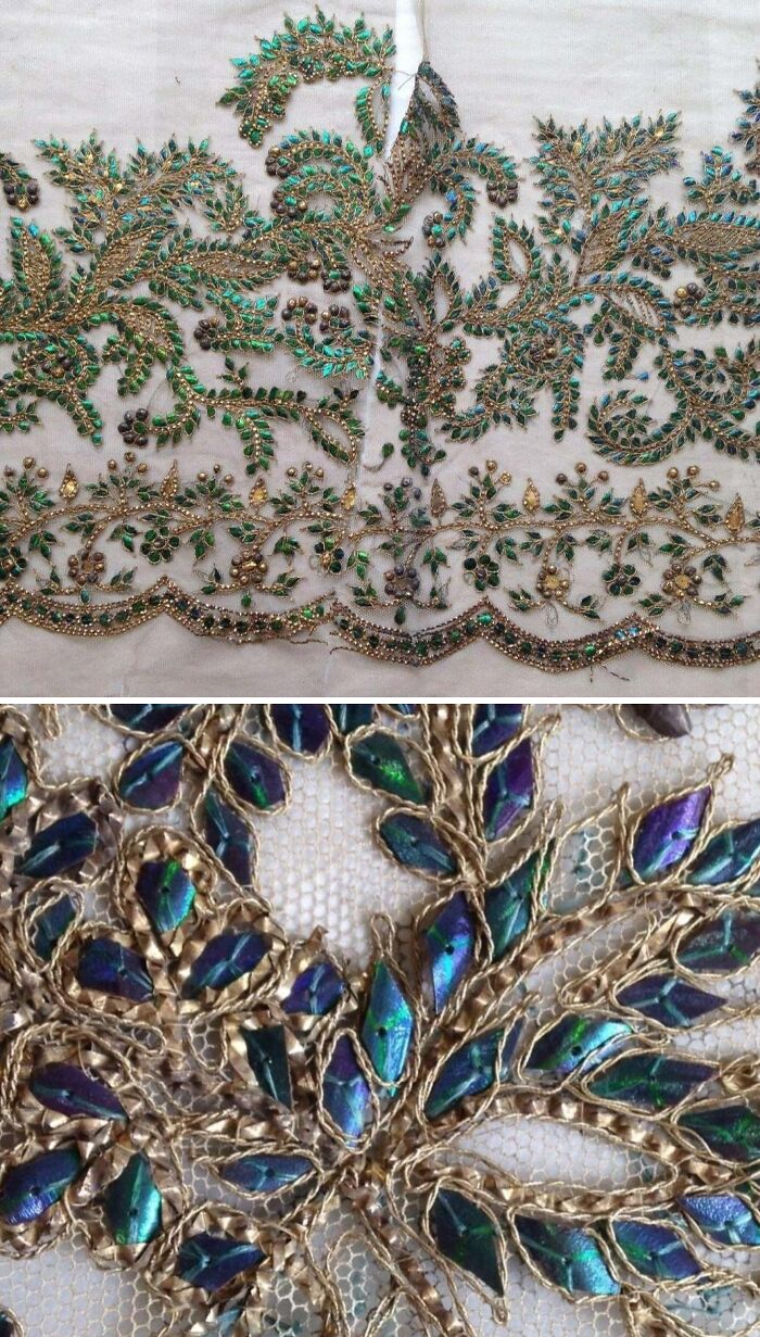 Intricate Victorian Era embroidery with gold thread and iridescent details on delicate fabric from historical period.