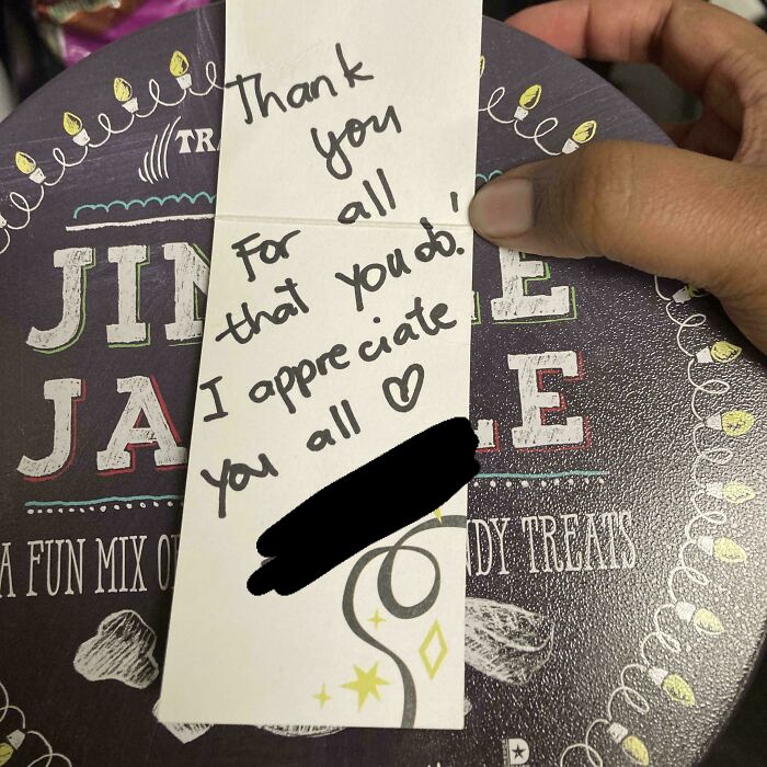 Handwritten thank you note held over a candy tin, illustrating workplace appreciation and why no one wants to work anymore.