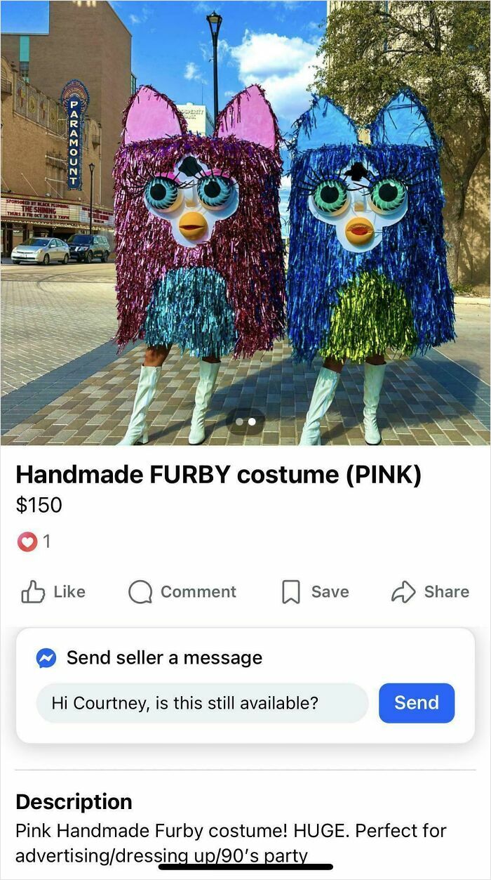 Two people wearing bizarre handmade Furby costumes in bright colors standing on a city sidewalk for sale online.