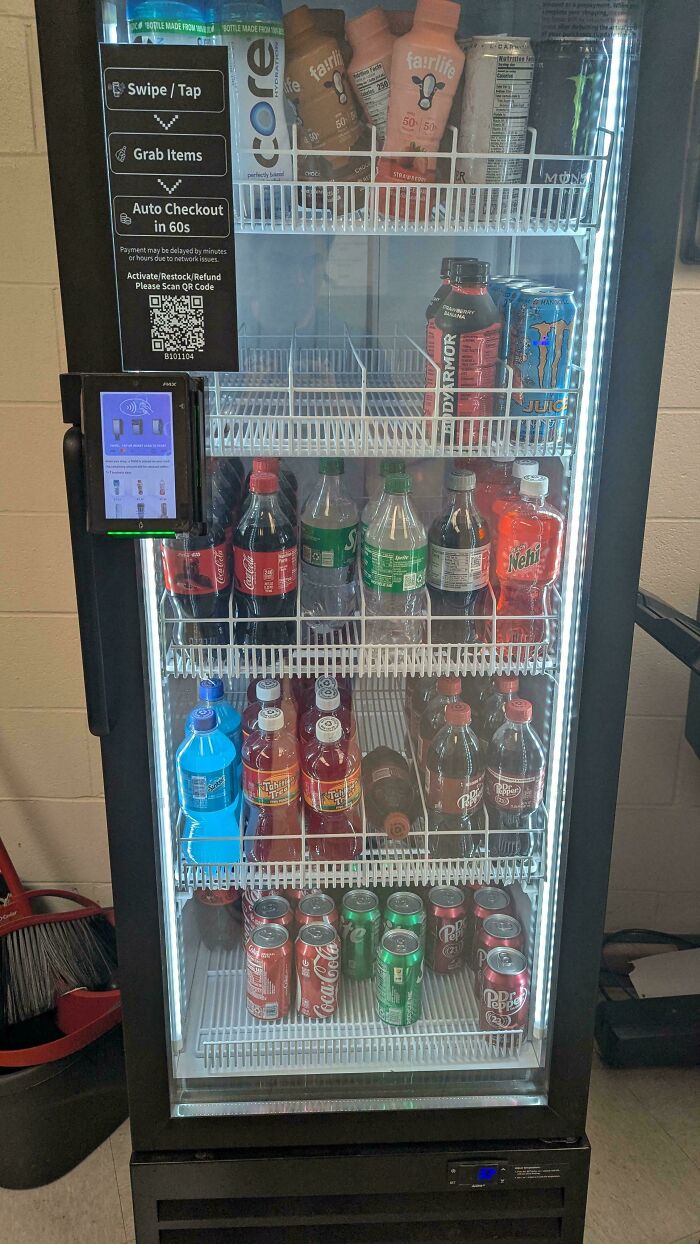 Workplace beverage cooler with various sodas and energy drinks highlighting why no one wants to work anymore.