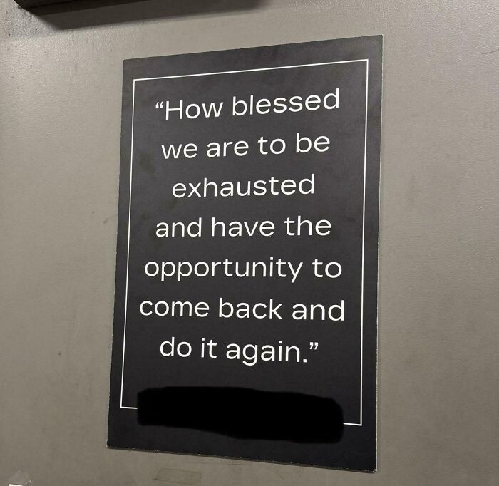 Motivational workplace sign about exhaustion and opportunity, highlighting shifting attitudes in the modern work environment.