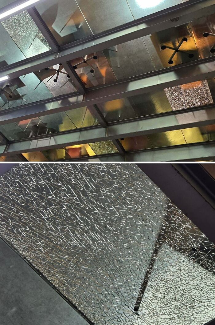 Broken glass ceiling panels in a workplace setting, symbolizing challenges in modern work environments.