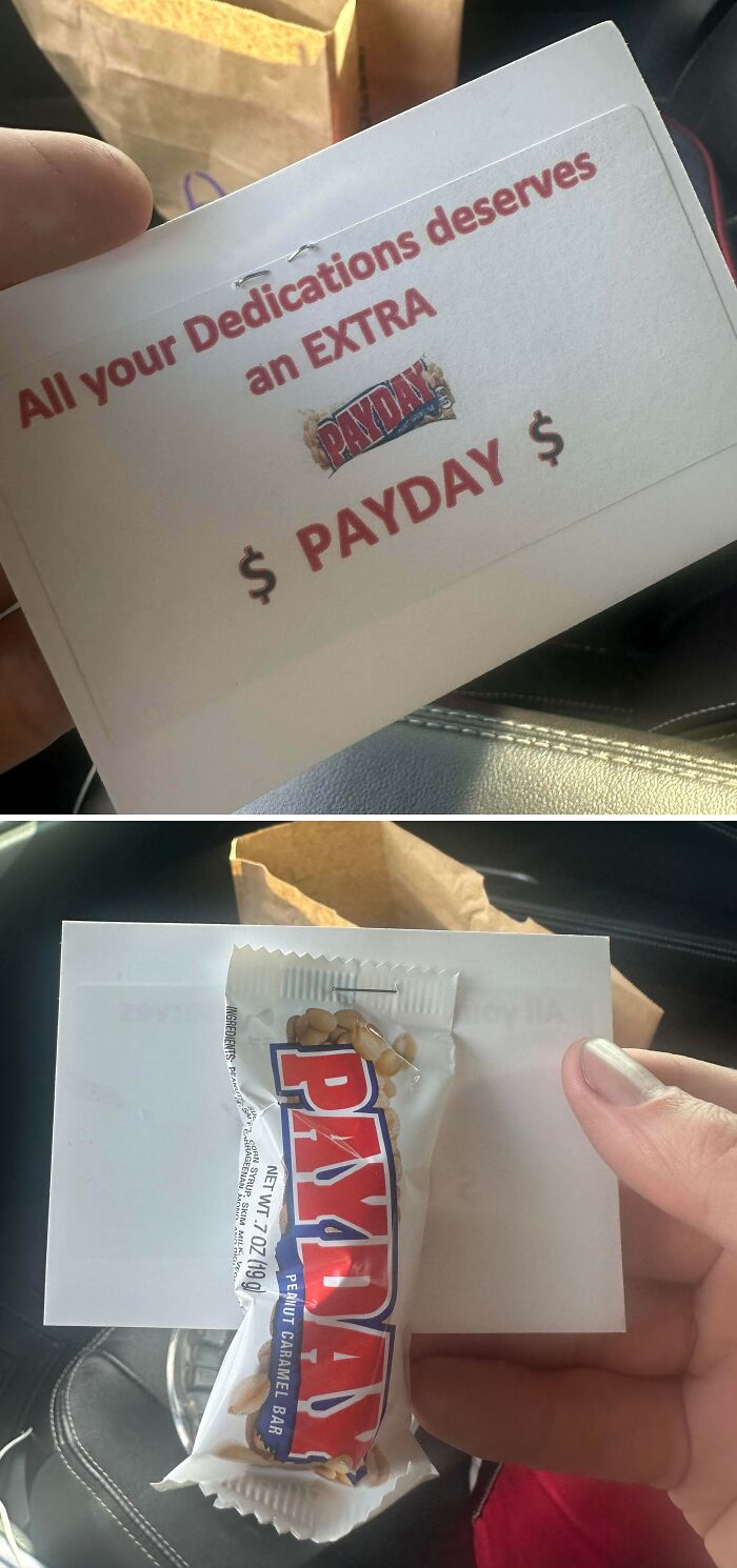 Hand holding a note and Payday candy bar showing the meaning of raise in workplace photos about pay and work.