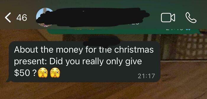 Screenshot of a workplace chat questioning a $50 Christmas present, highlighting why no one wants to work anymore.