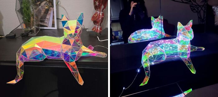 Colorful geometric cat DIY paper craft shown in daylight and lit up with fairy lights at night.