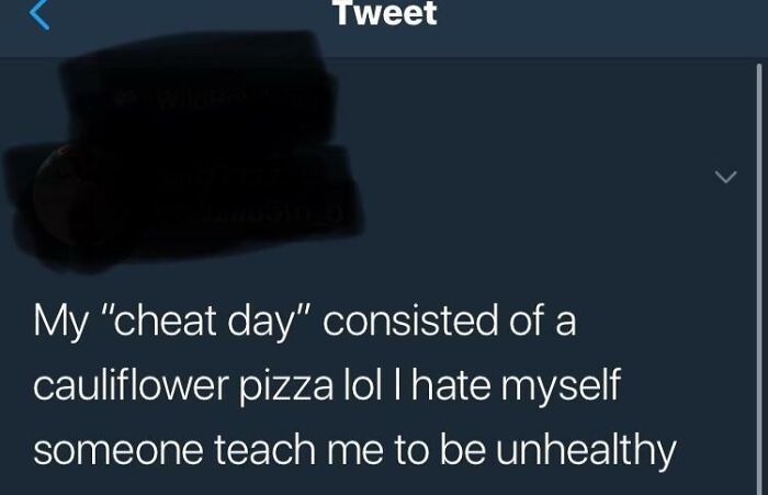 Tweet showing a funny cringe moment where someone jokes about their "cheat day" consisting of a cauliflower pizza.