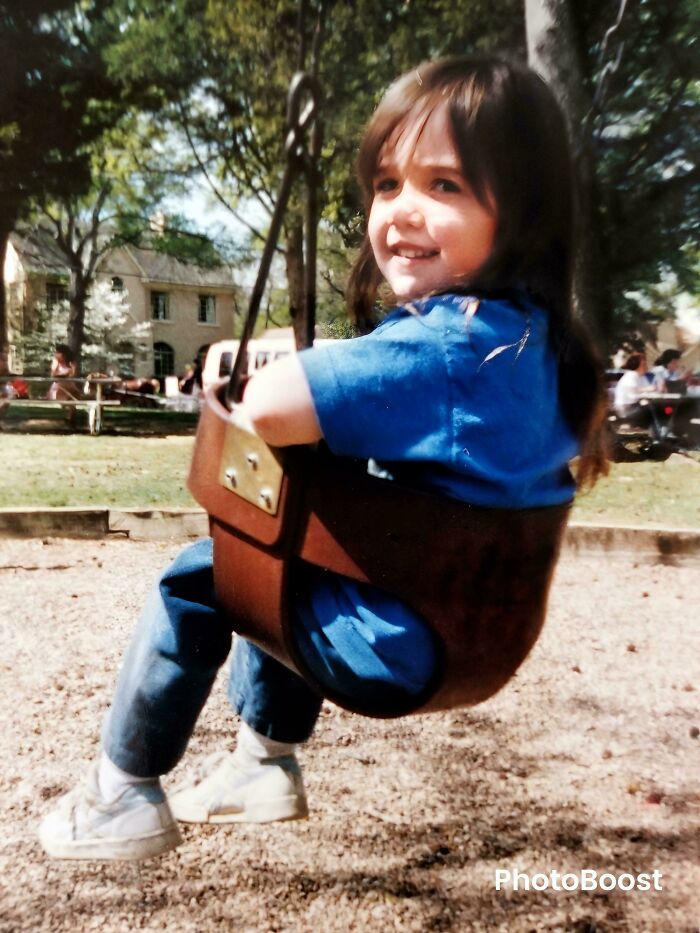 Young girl smiling on a swing in a park, evoking unsettling mysteries that continue to fascinate and disturb.