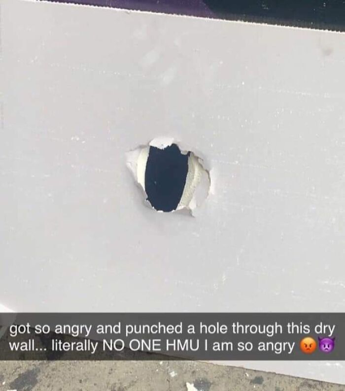 Hole punched through drywall in anger, illustrating a cringe-worthy moment of frustration and impulse.