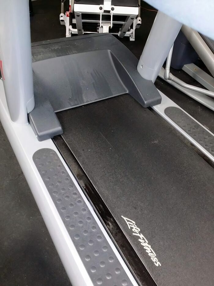 Treadmill in a gym setting, highlighting fitness equipment and an unusual setup that surprises gym-goers.