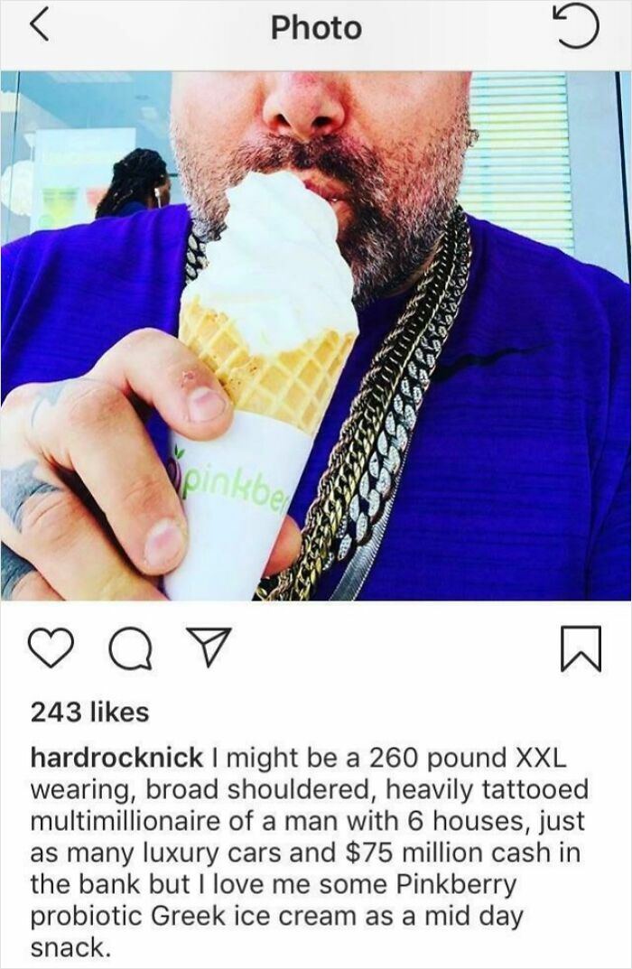 Man in purple shirt with heavy gold chains eating an ice cream cone, a photo that might trigger cringed feeling memories.