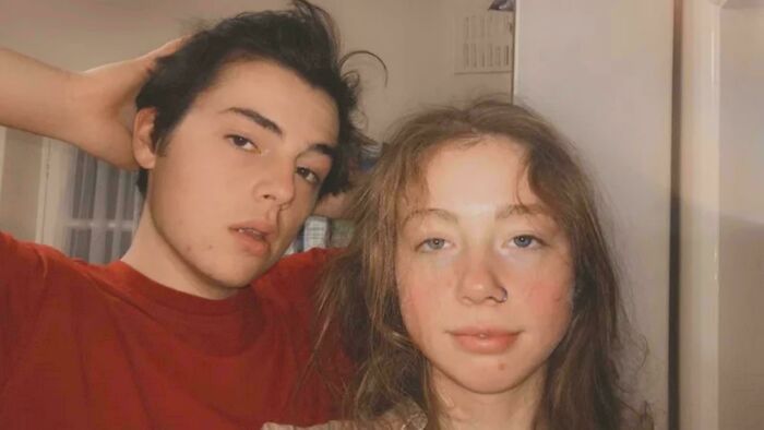 Two young people posing casually indoors, evoking the mood of unsettling mysteries that continue to fascinate.