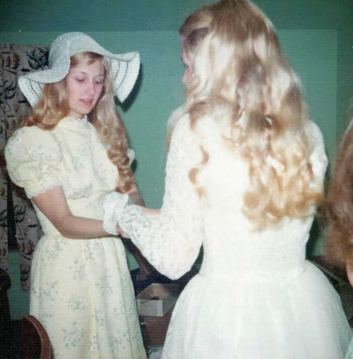 A candid old photo shows two women in dresses, one wearing a hat, revealing what the world looked like generations ago.