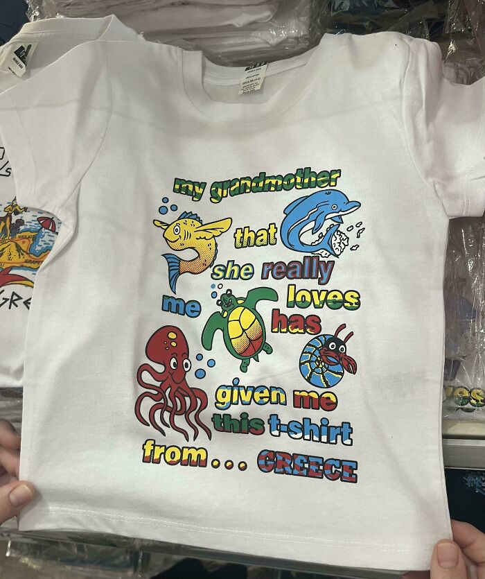 White T-shirt with colorful sea creatures and a mismatched phrase, showcasing hilariously bad t-shirt designs.