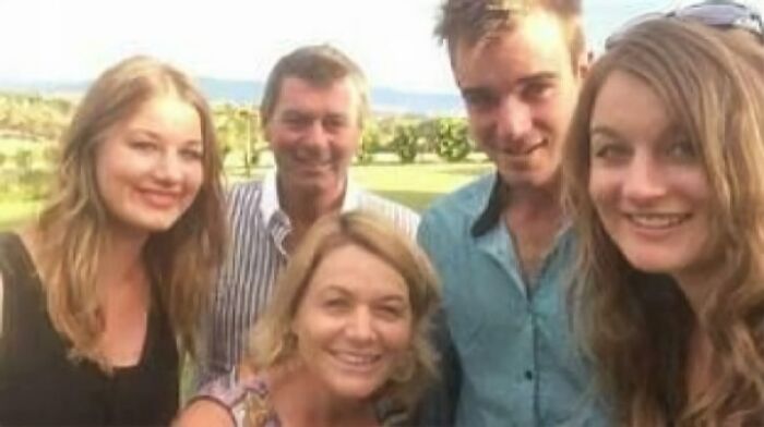 Group of five people smiling outdoors, representing unsettling mysteries that continue to fascinate and disturb.