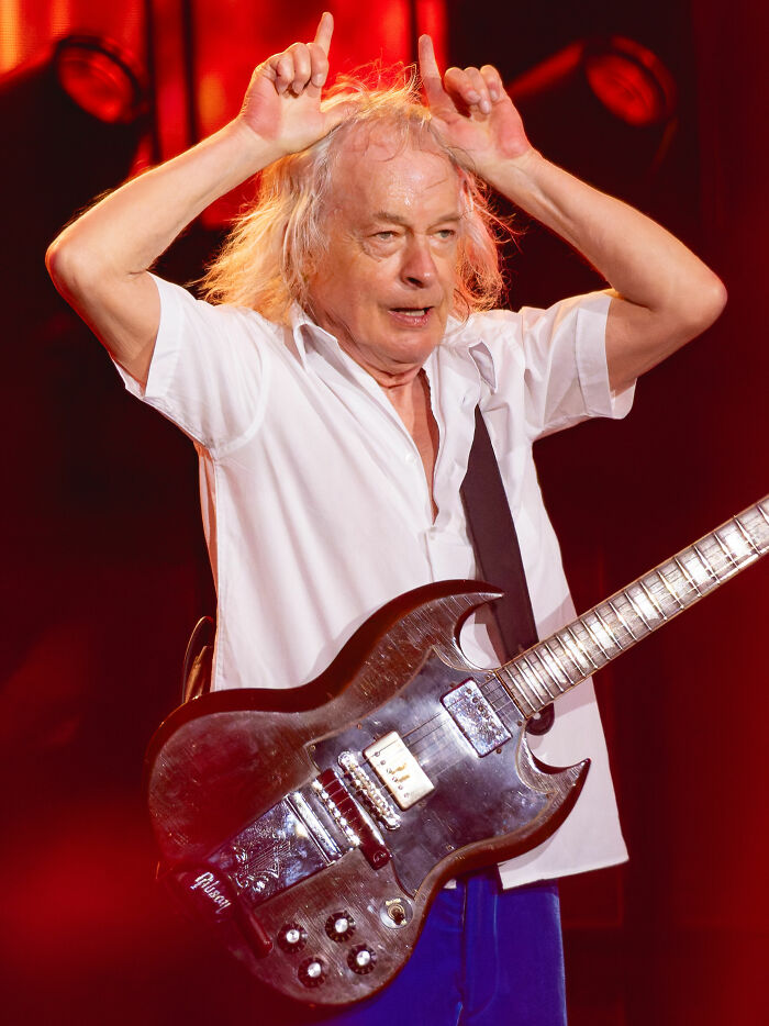 Scottish-Australian Guitarist and Songwriter Angus Young, 71