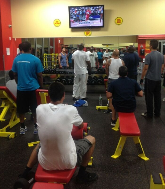 Several gym-goers watching a race on TV, capturing a Darwin Award contender moment at the gym.