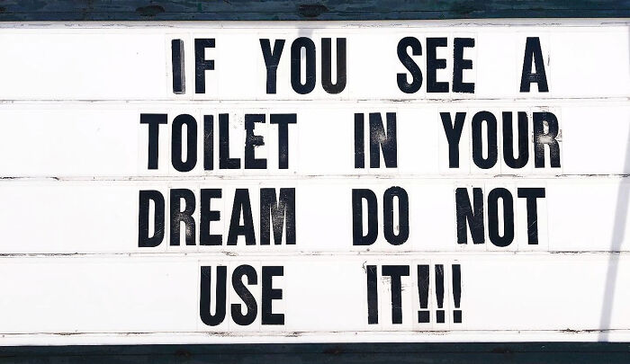 Marquee sign with funny advice about not using a toilet seen in a dream, showcasing quirky and humorous pieces of advice.
