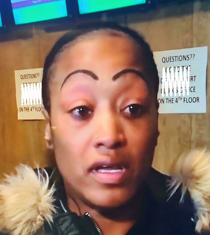 Woman with crazy eyebrows unusually shaped and uneven, giving the appearance of eyebrows living their own lives on her face.