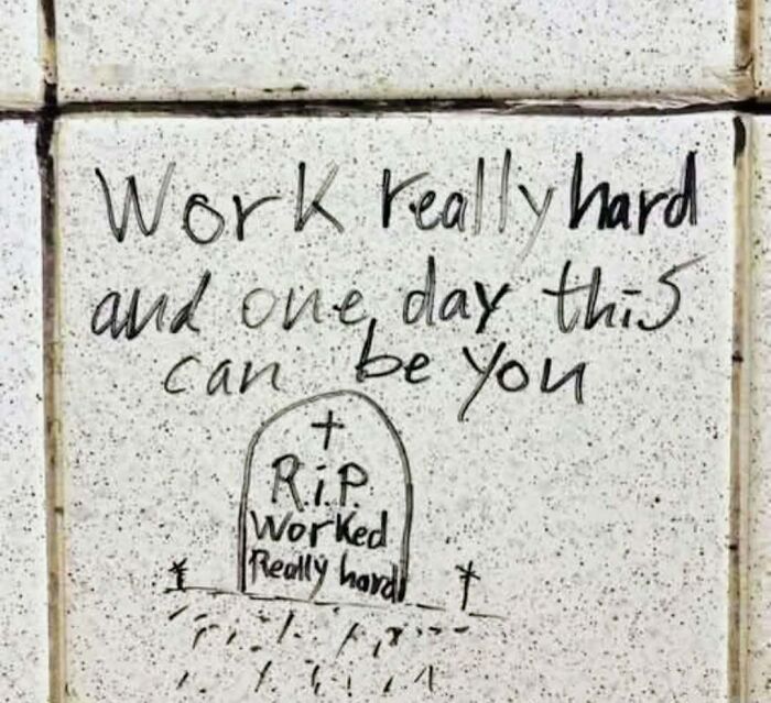 Philosophy meme graffiti showing a tombstone with RIP and message about working hard and existential humor.