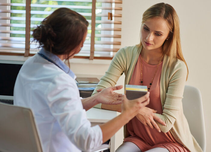 Female doctor explaining health concerns to a woman during a consultation about common issues thought to be part of being a woman.