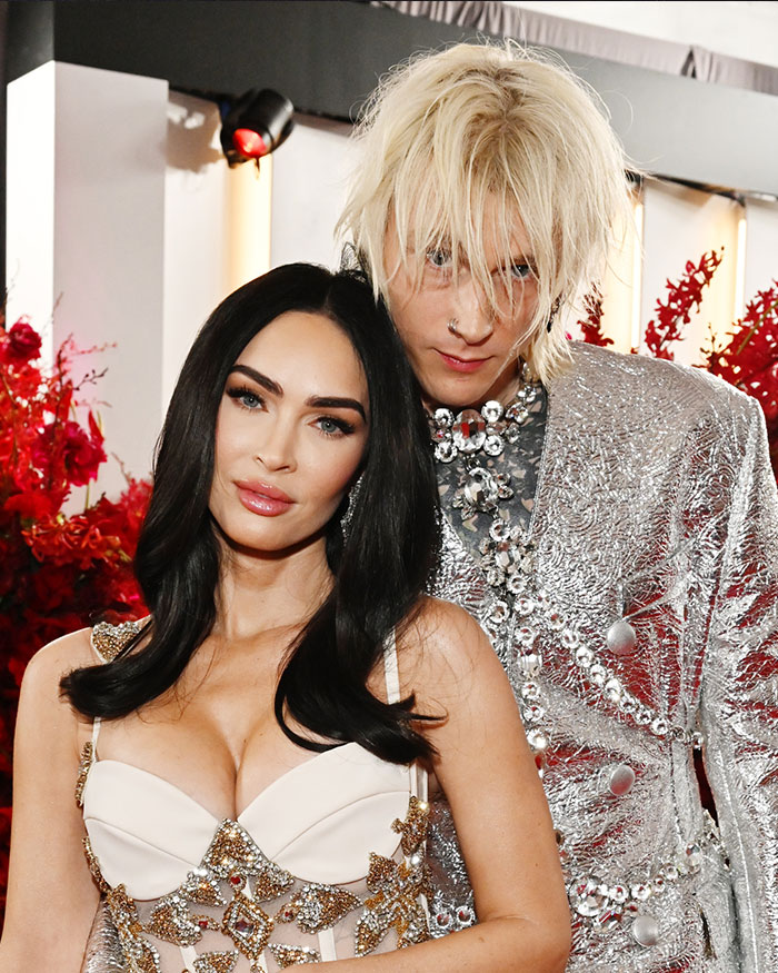 Megan Fox posing with a man in a silver outfit, sparking BBL rumors on Instagram with new photos. Megan Fox posing with a man in a silver outfit, sparking BBL rumors on Instagram with new photos.