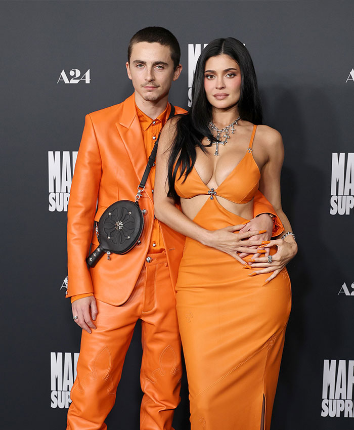 Kylie Jenner and her boyfriend posing in matching orange outfits with Hollywood rumor stirring whispers among his peers. Kylie Jenner and her boyfriend posing in matching orange outfits with Hollywood rumor stirring whispers among his peers.
