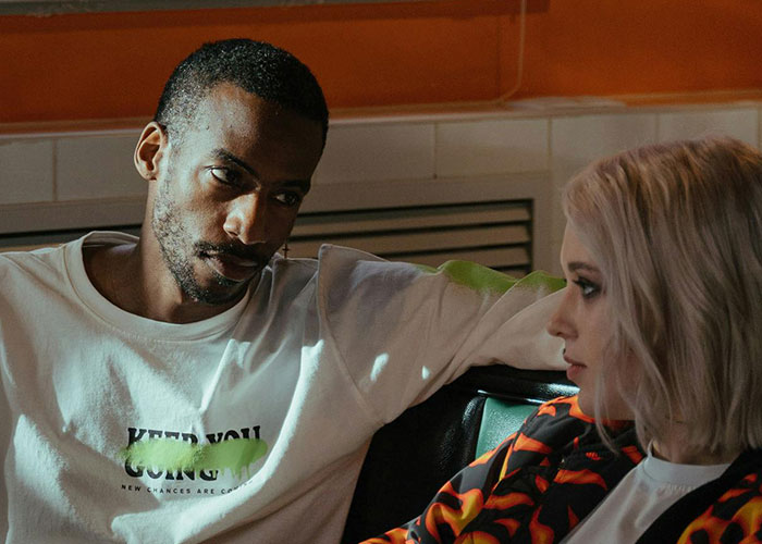 Man and woman sitting closely, having a serious conversation reflecting on moments their ex revealed who they really were.