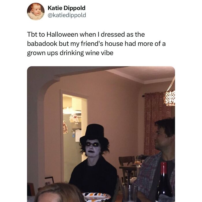Person dressed as the babadook at a Halloween party with a wine drinking vibe, showcasing funny and relatable memes.