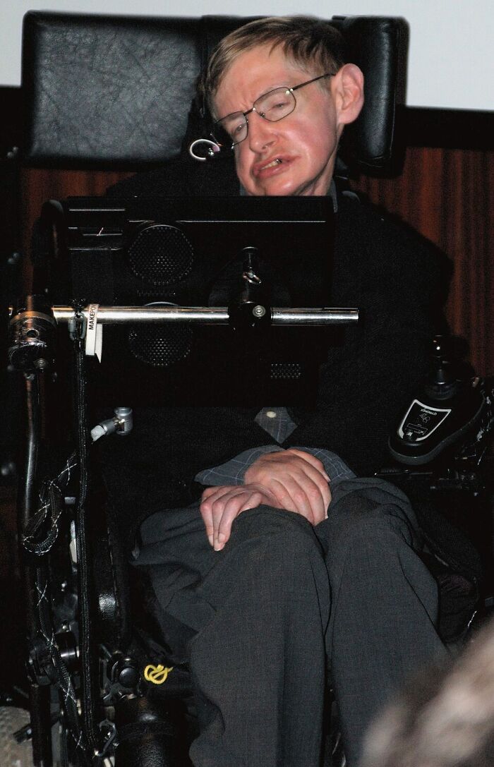 Man in wheelchair with communication device, representing deep exploration of interesting rabbit holes and unique insights.