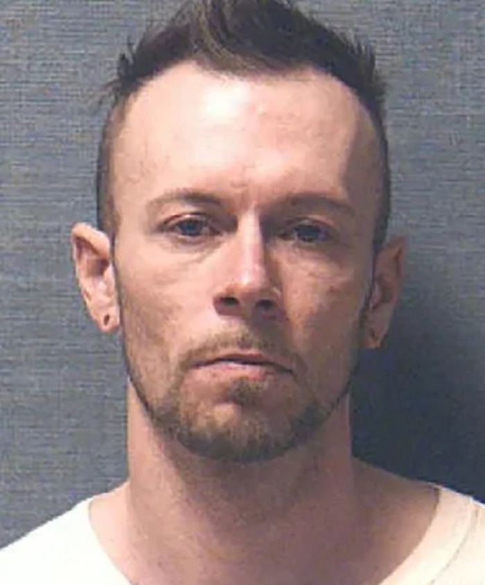 Mugshot of man accused of horrific crimes, reportedly found partying with spring breakers at Daytona Beach.