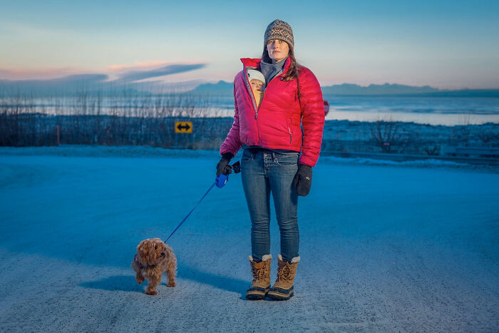Kaitlyn Reiley Walks With Her Seven Month Old Daughter, Beatrice, And Her Dog, Jack, Near Her Home On A Cold January Day In Anchorage, Alaska, 2015 From The Series 'Portrait-A-Day' By Clark James Mishler