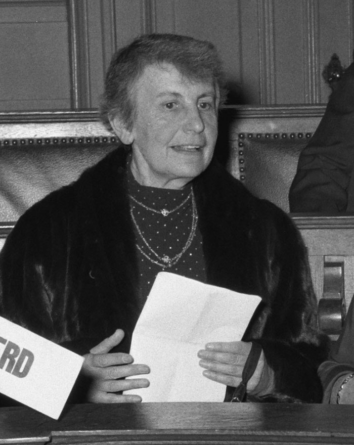 Black and white photo of a notable historical figure likely passed away as a virgin speaking at an event.