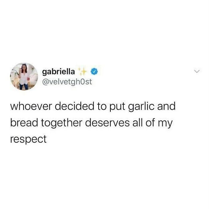 Tweet text appreciating the combination of garlic and bread, showcasing British humor in a simple social media meme.