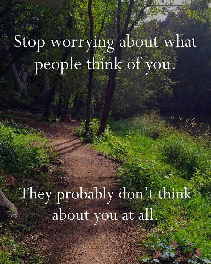 A serene forest path with anti-motivational affirmations about worrying and what people think of you.