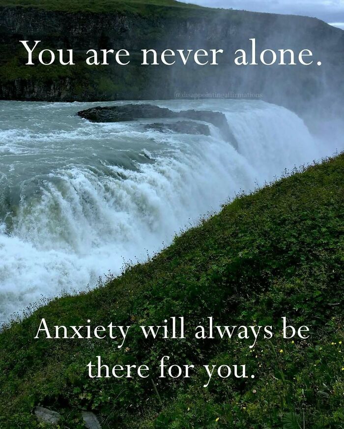 Waterfall with greenery and anti-motivational affirmations text about anxiety and never being alone.