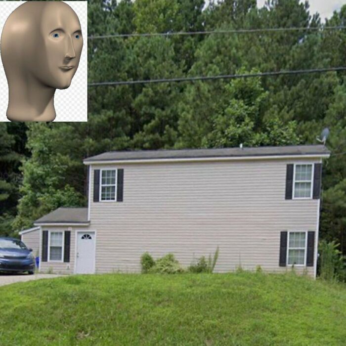 House with odd design disaster showing windows and door placement that make zero sense in home design.