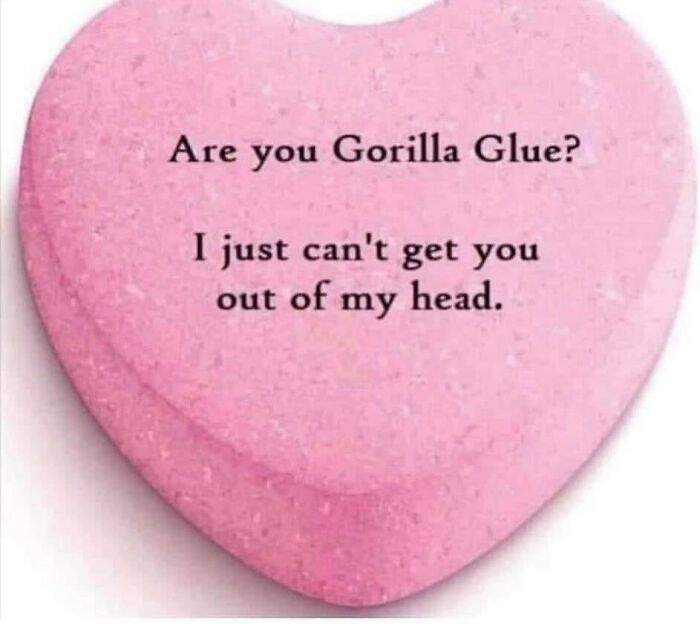 Pink heart-shaped candy with the humorous text about Gorilla Glue, fitting for doctor and patient memes about being tired.