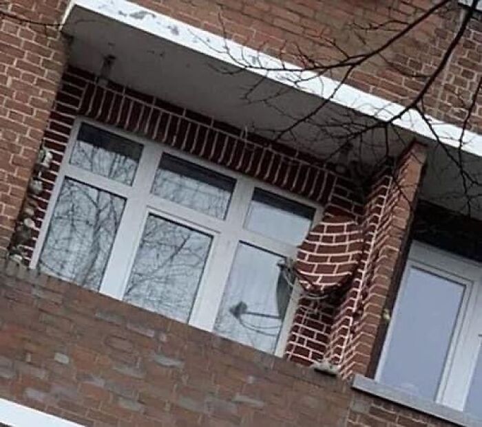 Balcony with a brick pillar bent awkwardly, illustrating a home design disaster that lacks both function and aesthetic appeal.