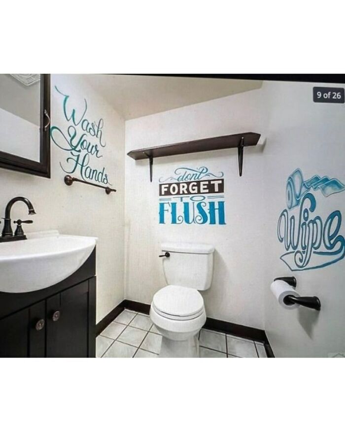 Small bathroom with confusing wall signs and home design disasters showing poor aesthetic choices.